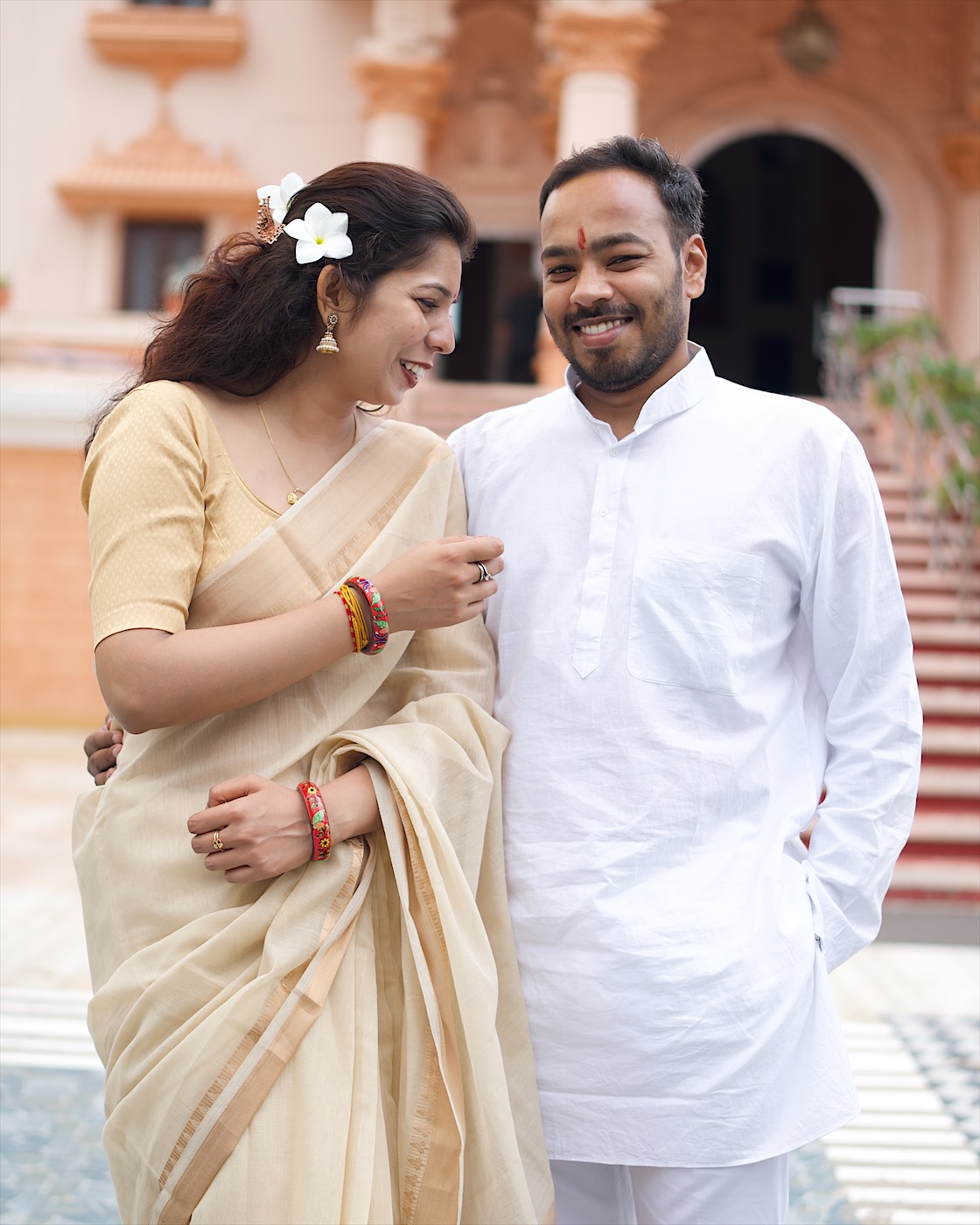 Smiling together, a flower in Astha's hair